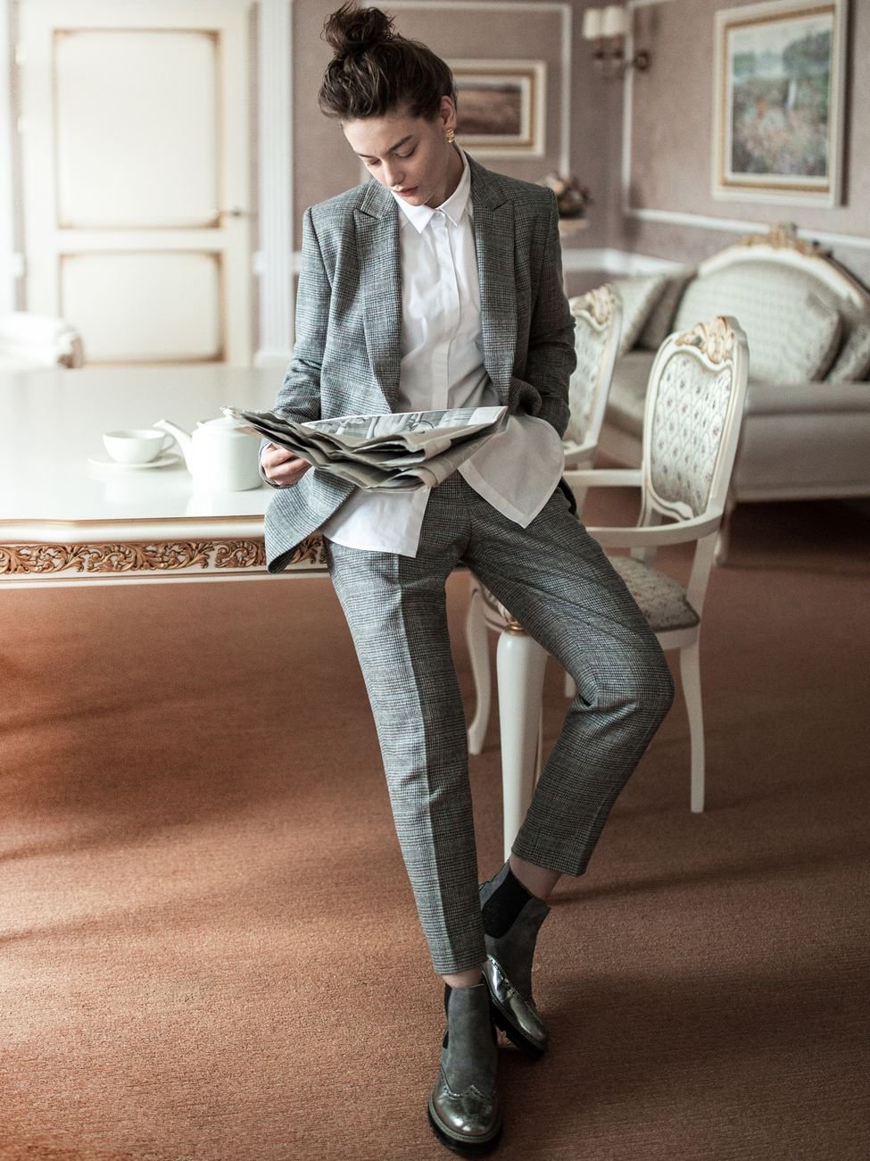 Woman in elegant grey suit — professional editorial fashion portrait