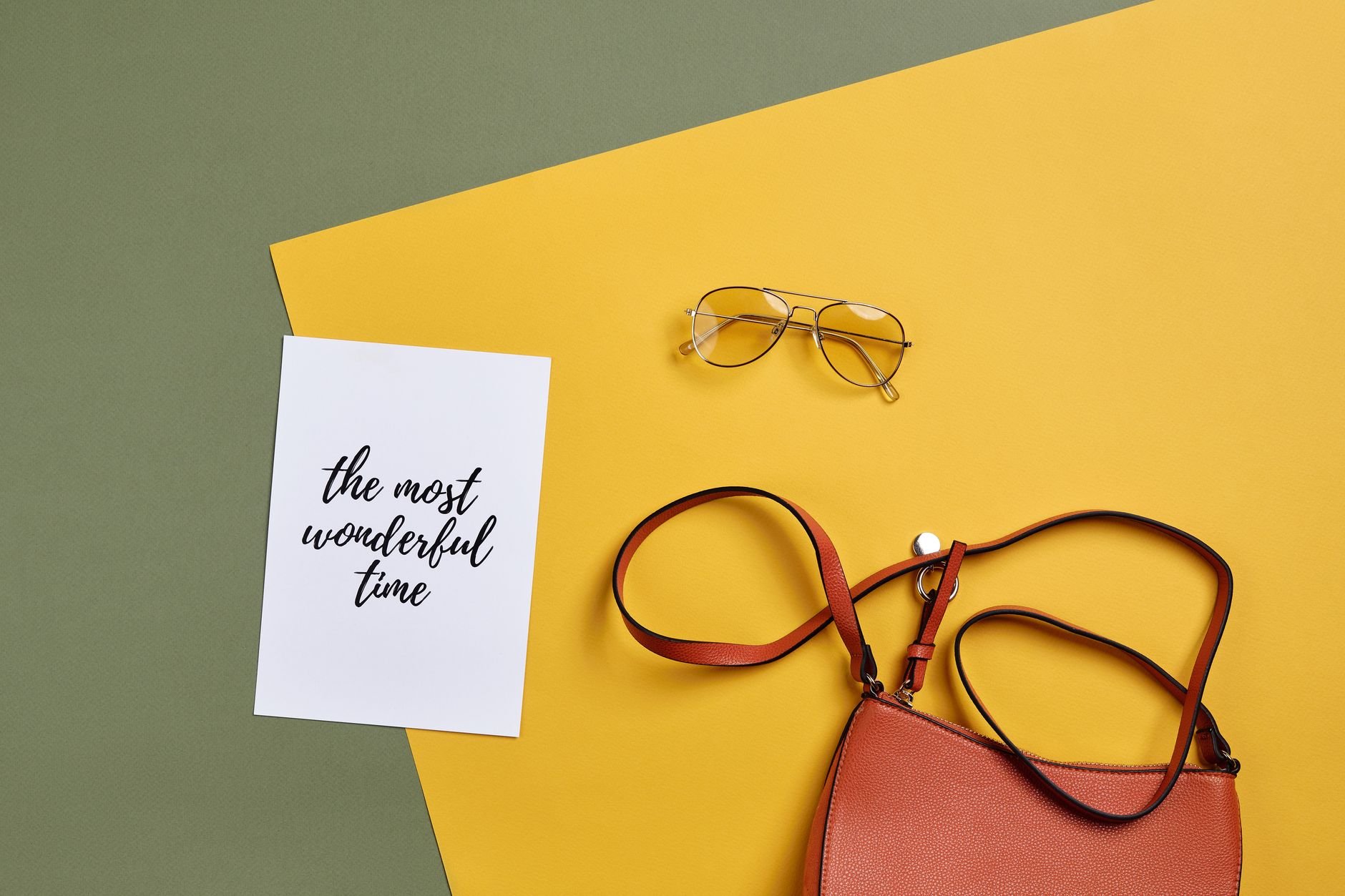 Handbag and sunglasses styled together — fashion accessories flat lay